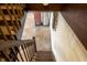 View of the stairs going down to the basement with white walls and exposed basement ceiling at 7727 Huff St, Indianapolis, IN 46259