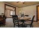 Traditional dining room showcasing a round table set with fine china and unique floral wallpaper border at 7727 Huff St, Indianapolis, IN 46259
