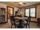 Charming dining area with a wooden table set for four, adjacent to the open kitchen concept at 7727 Huff St, Indianapolis, IN 46259
