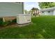 Exterior features a Generac generator, a swing, and a nice lawn at 7727 Huff St, Indianapolis, IN 46259