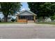 Charming home with a screened-in porch and well-maintained front yard at 7727 Huff St, Indianapolis, IN 46259