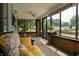 Cozy screened-in porch featuring comfortable seating and ample natural light at 7727 Huff St, Indianapolis, IN 46259