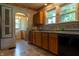 The kitchen showcases updated appliances, neutral backsplash, and plentiful natural light at 7727 Huff St, Indianapolis, IN 46259