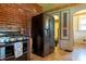 Kitchen featuring stainless steel appliances, brick accents, and ample space for culinary activities at 7727 Huff St, Indianapolis, IN 46259