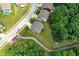 Aerial view of a home with a spacious backyard, surrounded by lush greenery and walking trails at 773 Bracknell Dr, Avon, IN 46123