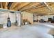 Large unfinished basement space with stairs, exposed ceiling, and wrapped walls at 773 Bracknell Dr, Avon, IN 46123