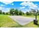 Outdoor basketball court with well-maintained surface and hoop nestled among green trees under a bright, sunny sky at 773 Bracknell Dr, Avon, IN 46123