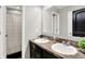 Bathroom with a double sink vanity and dark wood cabinets at 773 Bracknell Dr, Avon, IN 46123