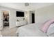 Bedroom with neutral walls and carpet, tv, dresser, walk-in closet with shelving and storage at 773 Bracknell Dr, Avon, IN 46123