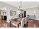 Dining room featuring modern light fixture, wood table and hardwood floors at 773 Bracknell Dr, Avon, IN 46123