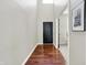 Entryway features hardwood floors, neutral paint, and a view into an adjacent room at 773 Bracknell Dr, Avon, IN 46123