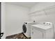 Laundry room with a front-load washer and top-load dryer, plus wire shelving at 773 Bracknell Dr, Avon, IN 46123