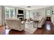 Inviting living room with hardwood floors, large windows, fireplace and ample seating at 773 Bracknell Dr, Avon, IN 46123