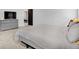 Neutral main bedroom featuring a gray bed and a dresser with TV at 773 Bracknell Dr, Avon, IN 46123