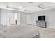 Spacious main bedroom featuring a tray ceiling and a large dresser with TV at 773 Bracknell Dr, Avon, IN 46123