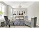 Home office area with neutral walls, carpet, and furniture with large sunny windows at 773 Bracknell Dr, Avon, IN 46123