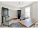 Home office area with neutral walls, carpet, and furniture with a black double door entrance at 773 Bracknell Dr, Avon, IN 46123