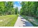 Scenic paved path surrounded by lush greenery, perfect for leisurely strolls and enjoying nature at 773 Bracknell Dr, Avon, IN 46123