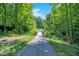 Charming paved path winding through a serene wooded area with a small bridge at 773 Bracknell Dr, Avon, IN 46123