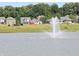 Tranquil pond with fountain in a residential neighborhood at 7909 Magnolia St, New Palestine, IN 46163