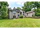 A view of the house from the back reveals a large lot with mature trees at 8004 Lafayette Rd, Indianapolis, IN 46278