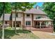Spacious backyard featuring a wooden deck, gazebo, and hot tub, perfect for outdoor entertaining at 8004 Lafayette Rd, Indianapolis, IN 46278