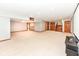 Large finished basement area with carpet, recessed lighting, and access to a stairwell at 8004 Lafayette Rd, Indianapolis, IN 46278