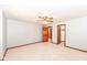 This carpeted bedroom features a ceiling fan and wood trim around doorways at 8004 Lafayette Rd, Indianapolis, IN 46278