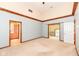 Large bedroom with carpet flooring and two entryways at 8004 Lafayette Rd, Indianapolis, IN 46278