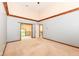Spacious bedroom with multiple entryways, carpet flooring, and decorative beams at 8004 Lafayette Rd, Indianapolis, IN 46278