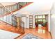 Spacious foyer with wood floors and staircase at 8004 Lafayette Rd, Indianapolis, IN 46278
