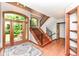 Bright foyer with hardwood floors, staircase, and natural light at 8004 Lafayette Rd, Indianapolis, IN 46278