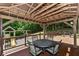 Gazebo featuring an outdoor dining table and chairs, overlooking the backyard and playset at 8004 Lafayette Rd, Indianapolis, IN 46278