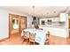 Eat-in kitchen featuring stainless steel appliances, white cabinets, and glass doors to patio at 8004 Lafayette Rd, Indianapolis, IN 46278