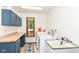 This laundry room features cabinets, a countertop, and a utility sink at 8004 Lafayette Rd, Indianapolis, IN 46278