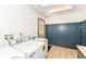 Tile laundry room featuring washer, dryer, utility sink, and coat rack at 8004 Lafayette Rd, Indianapolis, IN 46278