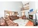 Bright, open living room featuring a fireplace and comfortable seating at 8004 Lafayette Rd, Indianapolis, IN 46278