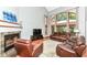 Vaulted living room with fireplace and large windows at 8004 Lafayette Rd, Indianapolis, IN 46278