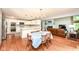 Open concept kitchen and living space, complete with fireplace, breakfast nook and tv at 8004 Lafayette Rd, Indianapolis, IN 46278