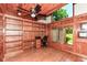 Office space with wood-paneled walls, built-in shelving, and a desk at 8004 Lafayette Rd, Indianapolis, IN 46278