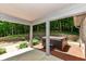 Covered patio with a hot tub and views of the greenery at 8004 Lafayette Rd, Indianapolis, IN 46278