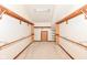 Spacious walk-in closet featuring custom shelving, hanging rods, and a neutral color palette at 8004 Lafayette Rd, Indianapolis, IN 46278