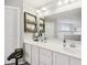 Bathroom featuring double sinks, quartz countertops, and a large mirror at 8126 Kilborn Way, Avon, IN 46123
