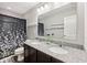 Bathroom boasts a double sink vanity with granite countertop and decorative shower curtain at 8126 Kilborn Way, Avon, IN 46123