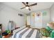 Bright bedroom features wood-look floors, ceiling fan, and a fun decor at 8126 Kilborn Way, Avon, IN 46123