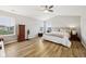 Bright bedroom with vaulted ceiling, light walls, wood-look floors, and large windows at 8126 Kilborn Way, Avon, IN 46123