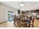 Elegant dining area with a view of the modern kitchen and outdoor patio, ideal for Gathering meals and gatherings at 8126 Kilborn Way, Avon, IN 46123