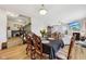 Dining room with decorative table and chairs, wood floors and open access to living areas at 8126 Kilborn Way, Avon, IN 46123