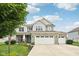 Charming two-story home featuring a stone facade, three-car garage, and manicured lawn in a well-kept neighborhood at 8126 Kilborn Way, Avon, IN 46123