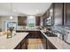 Well-appointed kitchen with stainless steel appliances, a large island, and quartz countertops at 8126 Kilborn Way, Avon, IN 46123